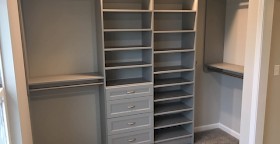 Master closet system in Cloud color with Allegra drawer fronts