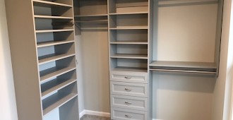 Master closet system in Cloud color with Allegra drawer fronts