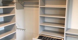 Master closet system in Cloud color with Allegra drawer fronts