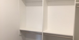 Walk-in closet with drawers, shoe tower and upper storage