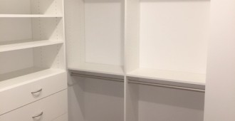 Walk-in closet with drawers, shoe tower and upper storage