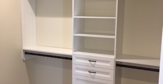 Custom walk-in closet system with oil-rubbed bronze hardware