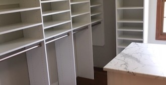 Walk-in closet with sloped ceiling and Island