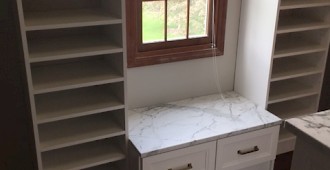 Walk-in closet with sloped ceiling and Island