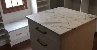 Walk-in closet with sloped ceiling and Island